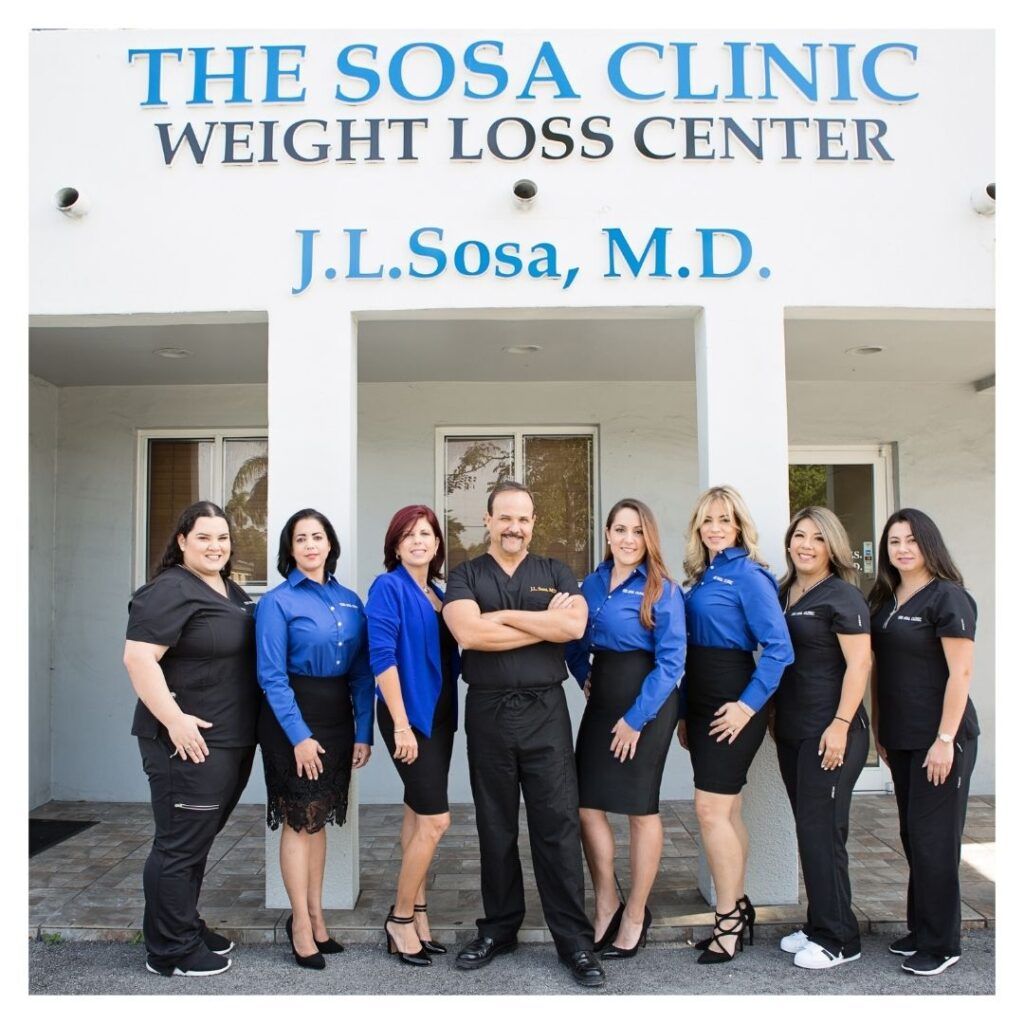 Dr. Sosa and his team standing outside of the clinic