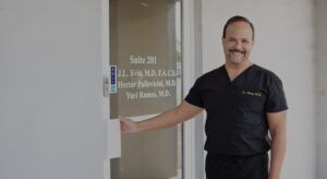 Dr. Sosa opening the door to his clinic