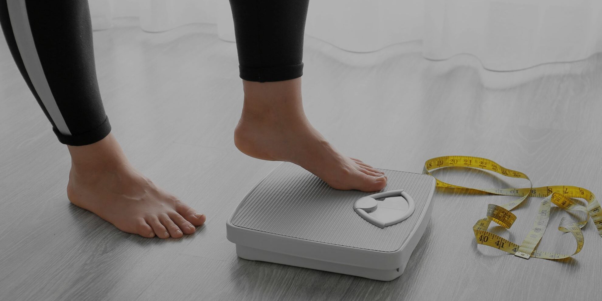 a person stepping onto a scale